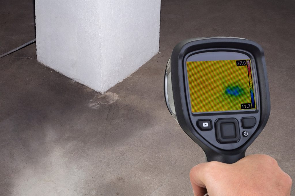 California Coast Plumbers technician inspecting a commercial plumbing system for hidden leaks